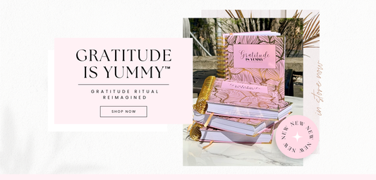 Gratitude is Yummy Journal physical edition with pink and gold cover on a marble surface for manifestation and positive minds